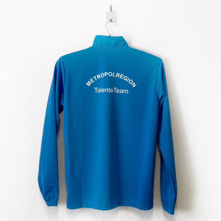 blaue Puma Zip Tops mit weißen Druck des Teamnamens