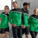 Die Erima Teamline 5-C grün schwarz weiß mit Polyesterjacke und Shirt