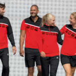 Die Erima Teamline 5-C rot schwarz weiß mit Präsentationsjacke und Poloshirt
