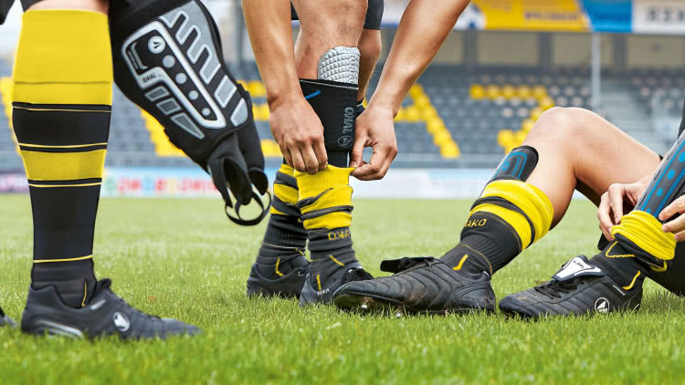 Training Socken oder Stutzen was tragen Fußballer